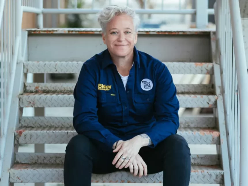 Australian of the year nominee Joanne Farrell sitting in uniform on steps