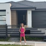 Ruby McLellan standing outside her property in Melbourne