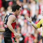 Stephen McBurney umpiring in AFL game