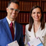 Treasurer Daniel Mookhey poses beside Courtney Houssos to announce NSW budget