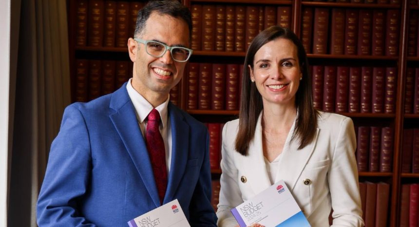 Treasurer Daniel Mookhey poses beside Courtney Houssos to announce NSW budget