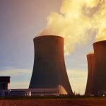 Smoke rising from the top of stacks from a nuclear power plant