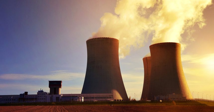 Smoke rising from the top of stacks from a nuclear power plant