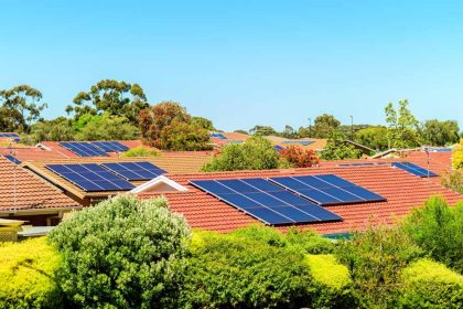 Solar panels on rooftops in Australian suburb on a sunny day