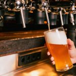 beer being poured in bar