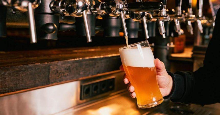 beer being poured in bar