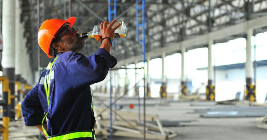 Tradie drinking alcohol on site