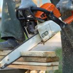 Chainsaw cutting into construction material at home