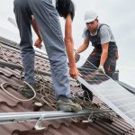 solar panel installation by two men