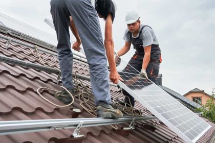 solar panel installation by two men