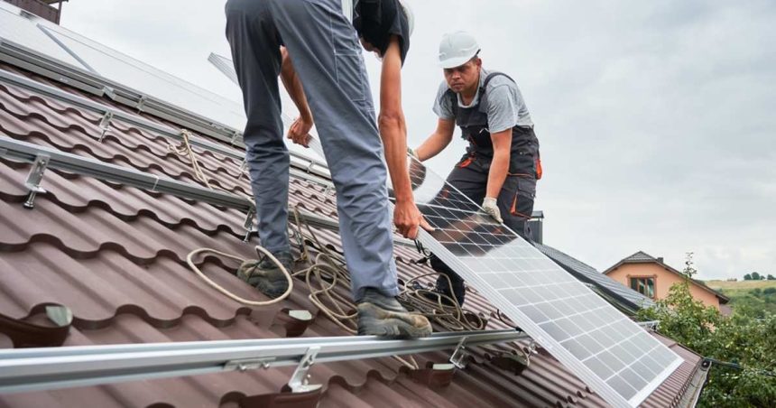 solar panel installation by two men