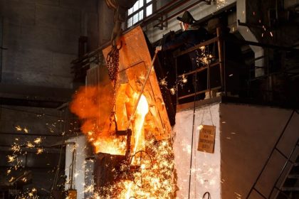 steel mill worker overseeing production