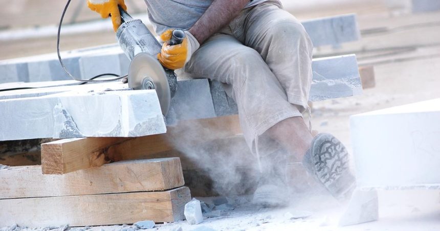 Engineered stone being cut by tradie