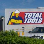 Total tools logo on the side of a store