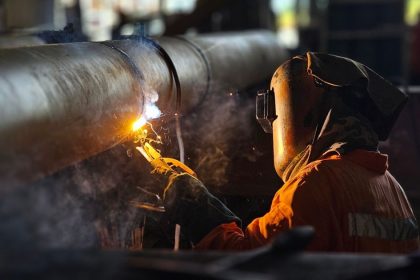 Welder working in factory