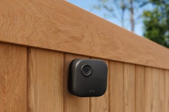 Blink Mini security camera on fence