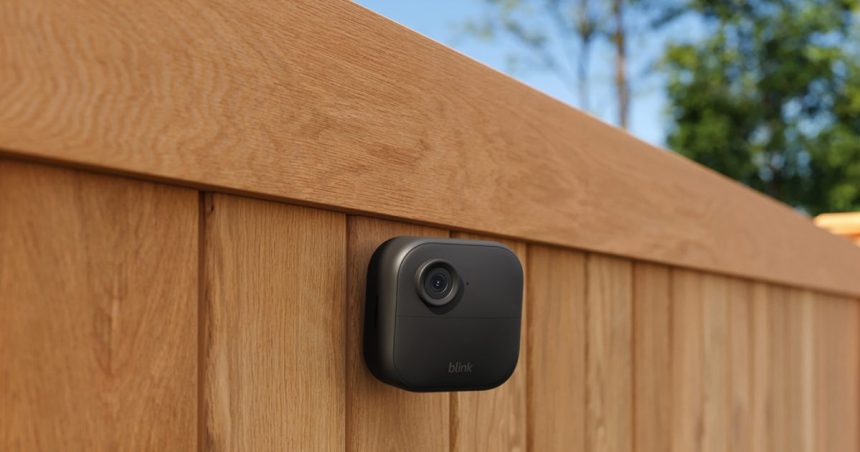 Blink Mini security camera on fence