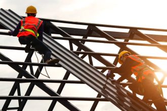 bolts and fasteners being used by tradies on a roof