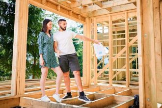 Couple inspecting their home while it's under construction