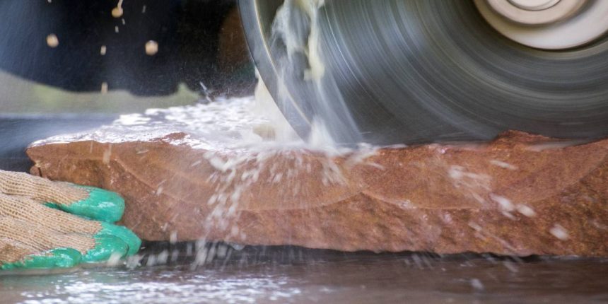 a stonemason cutting stone - silica