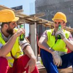 Tradies drinking beers on the job site after work