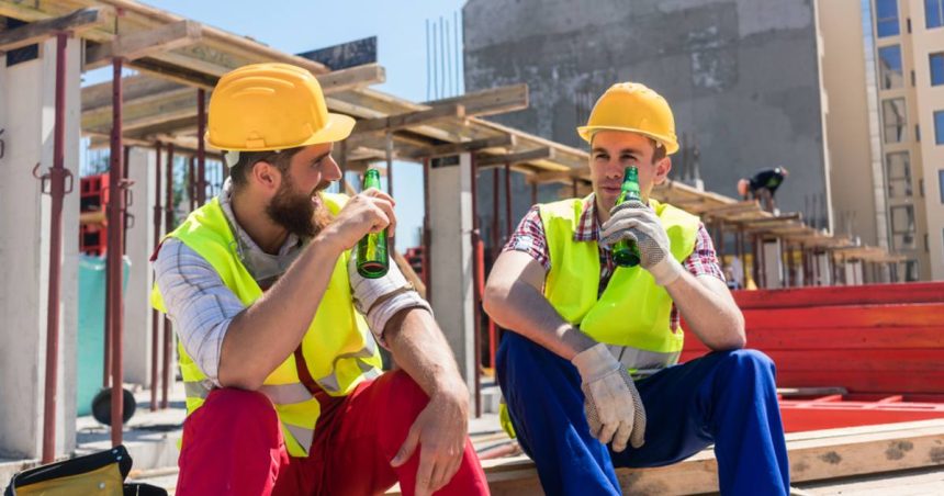 Tradies drinking beers on the job site after work