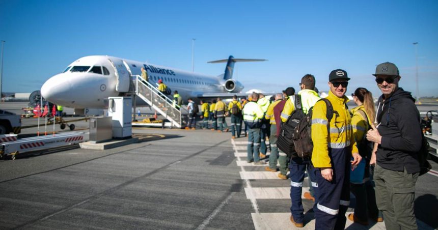 tradies lining up to board plane