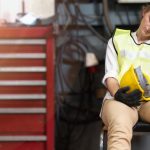 Female worker in construction distressed on the job