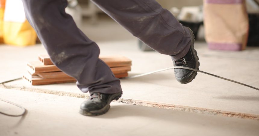 a man trips on a wire on site