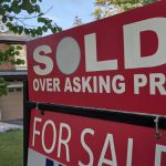 a sold sign outside house