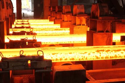 Steel beams being cast in factory