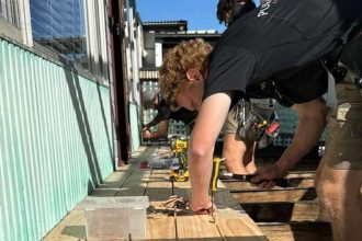 Tradies working on backyard porch