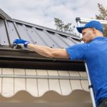 a man cleans his gutters